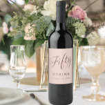Rose gold name script 50th birthday wine label<br><div class="desc">Rose gold gradient background. Fifty written with a dark rose gold script.  Personalize and add a name and date.</div>