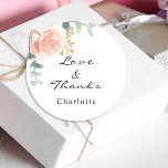 Rose gold pink floral eucalyptus thank you classic round sticker<br><div class="desc">A stylish white background. Decorated with green watercolored rose gold and blush pink floral,  rose,  eucalyptus leaves,  sprigs,  greenery,  faux gold leaves.  Personalize and add a name.  With the text: Love & Thanks.  
Perfect for birthday favours,  a bridal shower or baby shower.</div>