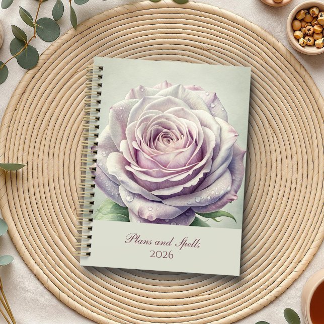 Rose Lune enchanté (Enchanted Moonlit Rose Planner on a boho table with botanicals and a cup of tea.)