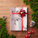 Rose Pink Christmas Snowflakes Wrapping Paper<br><div class="desc">An elegant Christmas wrapping paper featuring a pattern of pink metallic snowflakes set against a paler pink background to add a touch of festive class to your gift giving this holiday season.</div>