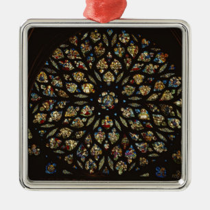 Rose window above the west door, with scenes depic metal ornament