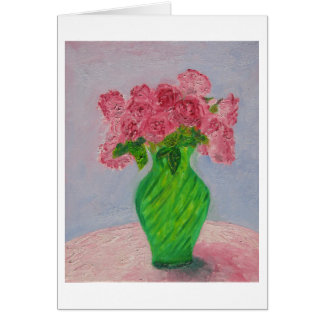 Roses roses dans le vase vert