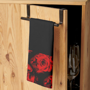 Roses rouges sur main noire ou serviette de cuisin