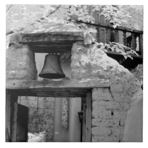Rough adobe bell in entryway, Santa Fe, New Tile
