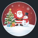 Round Christmas Sticker - Santa, Snowman & Tree<br><div class="desc">Add a touch of joy to your holidays with this adorable round Christmas sticker! Featuring a cheerful cartoon Santa Claus and a smiling Snowman standing beside a decorated Christmas tree and pile of gifts. The vibrant red background and falling snow create a classic festive atmosphere. Perfect for sealing envelopes, decorating...</div>