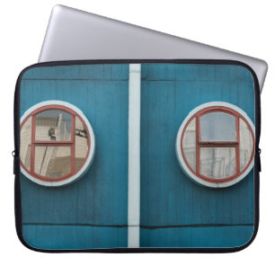 Round grey glass windows close-up photo laptop sleeve