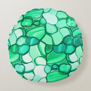 Round like stones in shades of clear green to mint pillow