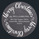 Round Merry Christmas Chalkboard Address Label<br><div class="desc">Add this round address label to the back of your Christmas card mailing and it will double as an envelope seal. The black chalkboard background will look great on any colour envelope. Merry Christmas is written in a bright white script font. Your family name and address are written on the...</div>