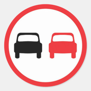 Round sticker with no overtaking traffic sign.