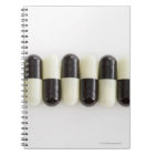 Row of Black and white pills