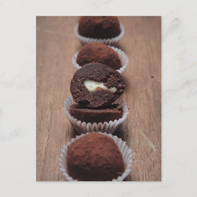 Row of chocolate truffles on wood postcard (Front)