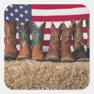 Row of cowboy boots on haystack square sticker