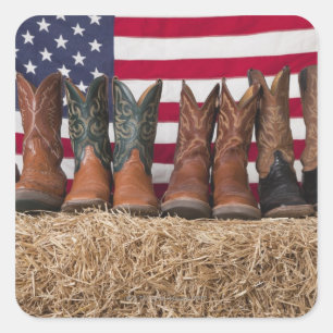 Row of cowboy boots on haystack square sticker