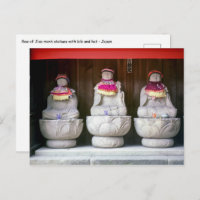 Row of Jizo monk statues with bib and hat - Japan