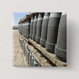 Rows of ammunition are stacked and prepped 2 inch square button