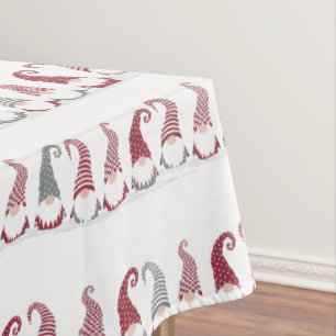 Rows of holiday gnomes in the snow tablecloth