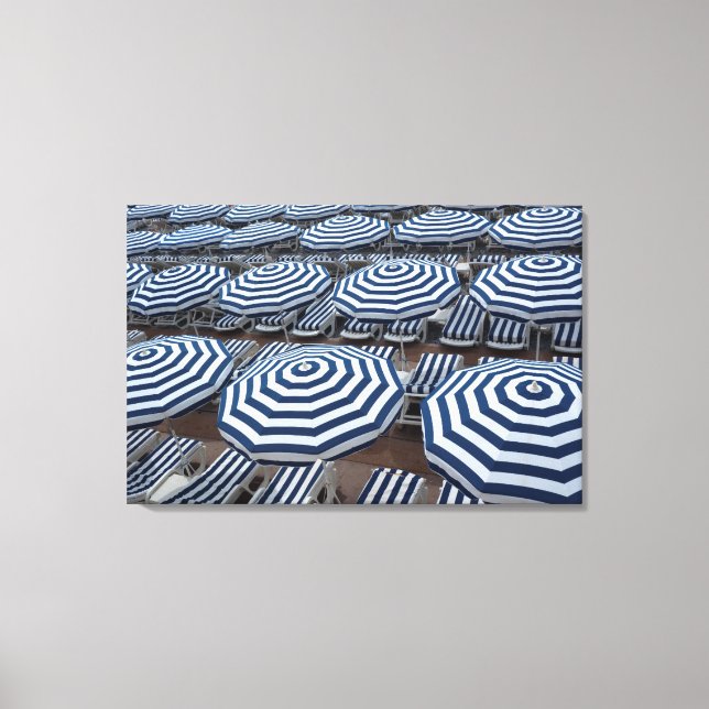 Rows Of Striped Beach Umbrellas With Sun Beds Canvas Print (Front)