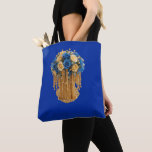 Royal Blue & Gold Floral — Tote Bag<br><div class="desc">Carry elegance everywhere you go with this stunning tote bag featuring a royal blue and gold floral arrangement. Blue and cream roses sit atop an ornate golden base with cascading beadwork, creating a regal, eye‑catching design. The deep blue background enhances the richness and sophistication of the artwork, making this tote...</div>