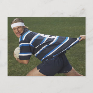 Rugby player getting shirt pulled postcard