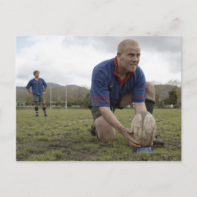 Rugby player positioning ball on rugby pitch postcard (Front)