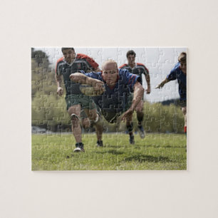 Rugby player scoring jumping on groud with ball jigsaw puzzle