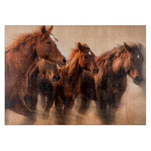 Running horses, blur and flying manes cutting board