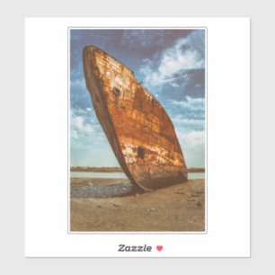 Rusted Shipwreck beached or stranded on a beach