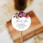 Rustic Autumn Marsala Floral Wedding Thank You Classic Round Sticker<br><div class="desc">Rustic floral wedding thank you stickers featuring watercolor fall flowers and foliage in shades of marsala, burgundy, purple, brown, and rust-orange. The elegant fall floral design is complimented by "thank you" displayed in a modern calligraphy script. Personalize the wedding thank you stickers with your names and wedding date. The autumn...</div>