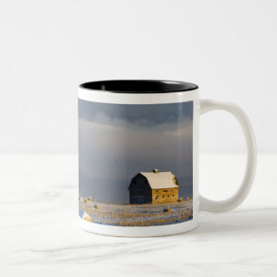 Rustic barn and hay bales after a fresh snow 3 Two-Tone coffee mug