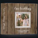 Rustic Barn Wood Calligraphy Photo Wedding Album Binder<br><div class="desc">Rustic or country wedding theme design featuring a square photo in a white shabby chic frame on a brown barn wood background. The words "Our Wedding" appear in modern white calligraphy style script on the cover, with the bride and groom's names and wedding date below in a smaller sans serif...</div>