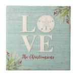 Rustic Beach Sand Dollar Tile<br><div class="desc">A beach themed ceramic tile with the word love, and personalized with your name underneath. A sand dollar seashell creates the "o" in the word love. This coaster has a weathered textured wood background and the corners are decorated with sea grasses. This sand dollar ceramic tile is a great addition...</div>