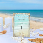 Rustic Beach String Lights Wedding Table Number<br><div class="desc">Complete your coastal rustic beach wedding table décor with these table number cards. Aqua blue ocean waves crash on the beach with white sea foam spray,  framed with weathered wood and string lights on top.</div>