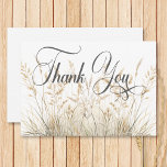 Rustic Boho Dried Tan Grass Wedding Thank You Card<br><div class="desc">Embrace the bohemian spirit with our wedding design, a poetic blend of nature-inspired charm and free-spirited elegance. Against a pristine white canvas, a gentle watercolor spray of dried field grasses in soft tans and browns unfolds, capturing the essence of rustic simplicity and the untamed beauty of the great outdoors. This...</div>