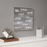Rustic driftwood ocean beach handwritten script square wall clock<br><div class="desc">Summer ocean beach clock with rustic driftwood background and sea,  ocean,  beach handwritten script.</div>