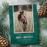 Rustic Emerald Green Winter Christmas Single Photo Holiday Card<br><div class="desc">This simple and rustic holiday design features your best portrait photo over a rustic paper texture in emerald green colour and the word "Merry Christmas" in vintage script text . Perfect for farmhouse style greeting cards. Easily add your best photo, your family names and year using the template. Add a...</div>