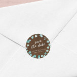 Rustic Eucalyptus and Brown Wood Save the Date Classic Round Sticker<br><div class="desc">This rustic wedding sticker features eucalyptus leaves with the words "save the date" in trendy script all against a brown wood background. Personalize it by replacing the placeholder text in the template to add your information. For more options such as to change the font and it's size/colour or the spacing...</div>