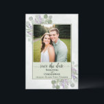 Rustic Eucalyptus & Lavender Green Wedding Photo Save The Date<br><div class="desc">This wedding save the date card is simple, rustic, elegant, and beautiful. It features your photo in a light sage green coloured frame surrounded by a bevy of hand painted watercolor eucalyptus leaves and lavender flowers on a marbled pale steel blue background. The title reads: Save the Date in lacy...</div>