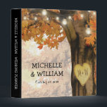 Rustic Fall Autumn Tree Twinkle Lights Wedding Binder<br><div class="desc">Autumn woodland wedding planner album featuring a rustic fall tree covered in red, orange and yellow leaves, a carved heart with your initials, string twinkle lights and a modern text template. For further customization, please click the "Personalize it" button to modify this template. All text style, colours, and sizes can...</div>