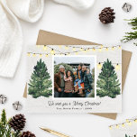 Rustic Family Photo Christmas Tree Farm Wood Holiday Card<br><div class="desc">Elegant "We wish you a Merry Christmas!" holiday photo card design features a rustic chic winter scene from a Christmas tree farm that frames a favourite family photo. Includes a white wood grain background with hanging string twinkle lights and fresh-cut green watercolor pine trees. Personalize with your choice of greeting,...</div>