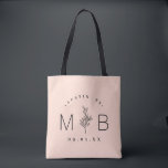 Rustic Floral Stem Wedding Monogram | Blush Tote Bag<br><div class="desc">Custom printed tote bags make a fun and functional wedding favour your guests will love! Personalize the template with the bride and groom's names or monogram initials. Add your wedding date, the city, state or venue name or any other custom text. This modern rustic logo-style design has a simple floral...</div>