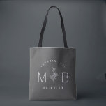 Rustic Floral Stem Wedding Monogram | Charcoal Tote Bag<br><div class="desc">Custom printed tote bags make a fun and functional wedding favour your guests will love! Personalize the template with the bride and groom's names or monogram initials. Add your wedding date, the city, state or venue name or any other custom text. This modern rustic logo-style design has a simple floral...</div>