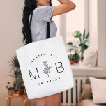 Rustic Floral Stem Wedding Monogram | White Tote Bag<br><div class="desc">Custom printed tote bags make a fun and functional wedding favour your guests will love! Personalize the template with the bride and groom's names or monogram initials. Add your wedding date, the city, state or venue name or any other custom text. This modern rustic logo-style design has a simple floral...</div>