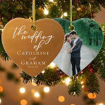 Rustic Gold Wedding Photo Keepsake Christmas Ceramic Ornament<br><div class="desc">These custom rustic gold wedding Christmas ornament feature elegant personalized white typography on an understated earth tone and your couple photo on the back. Simple light orange and brown hues follow the current fall trends for a bohemian wedding this autumn. Complete the look with your minimalist script on this keepsake...</div>