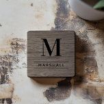 Rustic Grey Brown Wood Custom Monogram Initial Coaster<br><div class="desc">This simply elegant custom monogrammed beverage coaster set features classic black monogram text that can be personalized with a last name initial and last name. A beautiful keepsake gift for a newlywed couple, family, or new homeowners. A weathered grey brown faux wood grain background adds a rustic textured look to...</div>