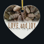 Rustic Holiday Love and Joy Pine Cone Ceramic Ornament<br><div class="desc">Festive,  rustic pine cones accentuate this classic,  elegant design wishing holiday Love and Joy.</div>