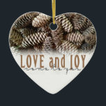 Rustic Holiday Love and Joy Pine Cone Ceramic Ornament<br><div class="desc">Festive,  rustic pine cones accentuate this classic,  elegant design wishing holiday Love and Joy.</div>