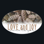 Rustic Holiday Love and Joy Pine Cone Oval Sticker<br><div class="desc">Festive, rustic pine cones accentuate this classic, elegant design wishing holiday Love and Joy.</div>