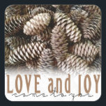 Rustic Holiday Love and Joy Pine Cone Square Sticker<br><div class="desc">Festive,  rustic pine cones accentuate this classic,  elegant design wishing holiday Love and Joy.</div>