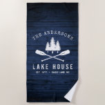 Rustic Lake House Boat Oars Trees Blue Wood Print Beach Towel<br><div class="desc">A beautiful, rustic themed beach towel, featuring your family name and "Lake House" or other desired text along with its established date and location. This custom, unique design features a white silhouette of crossed boat oars and pine trees on a print of wood planks in rich blue colours. To see...</div>