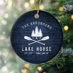 Rustic Lake House Boat Oars Trees Blue Wood Print Ceramic Ornament<br><div class="desc">A beautiful, rustic themed ceramic ornament, featuring your family name and "Lake House" or other desired text along with its established date and location. This custom, unique design features a white silhouette of crossed boat oars and pine trees on a print of wood planks in rich blue colours. A charming...</div>